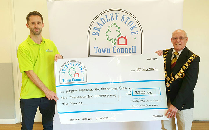 Photo of Cllr Tony Griffiths handing over Mayor's Charity cheque in 2021