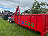 Photo of tractor collecting grass cuttings
