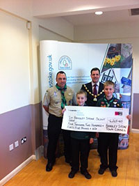 Ben Walker presenting a cheque to 1st Bradley Stoke Scout Group