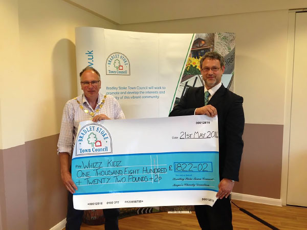 Former Mayor Councillor Brian Hopkinson presents a Charity Cheque to 'Whizz Kidz' (Pictured Mike Walmsley).