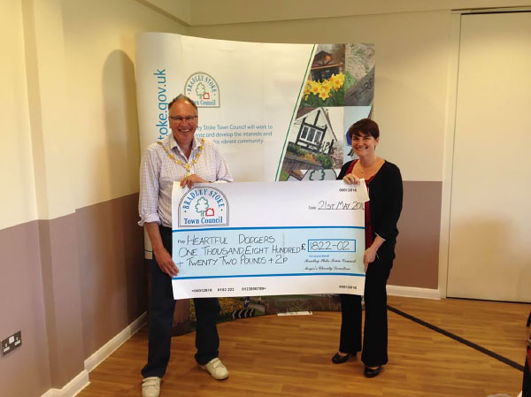 Former Mayor Councillor Brian Hopkinson presents a Charity Cheque to 'Heartful Dodgers' (Pictured Louise Hill).