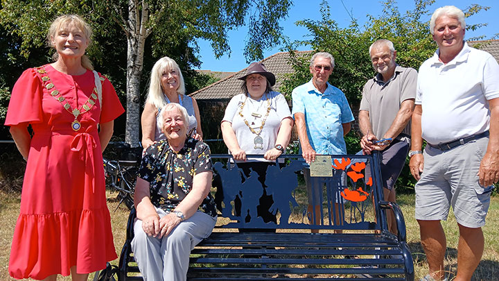Photo of Mayor, town councillors and representatives from Stoke Lodge & The Common Parish Council attending Manor Farm roundabout memorial bench unveiling on Thursday 10th July 2025